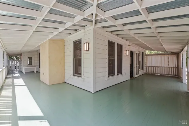 a view of a hallway with staircase