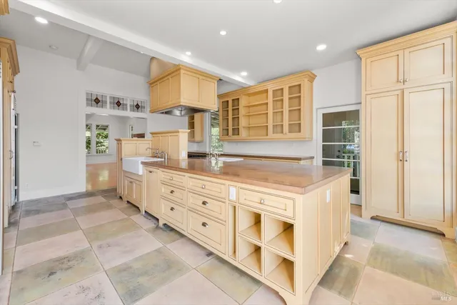 a kitchen with cabinets and window