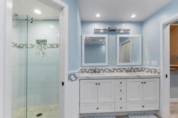 a spacious bathroom with a table and a sink