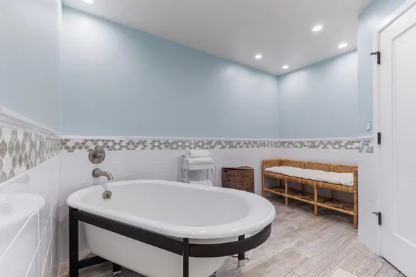 a en suite bathroom with a sink and a mirror