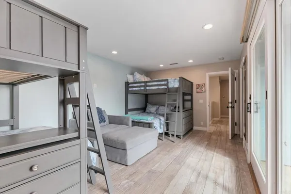 a bedroom with a bed and a night stand