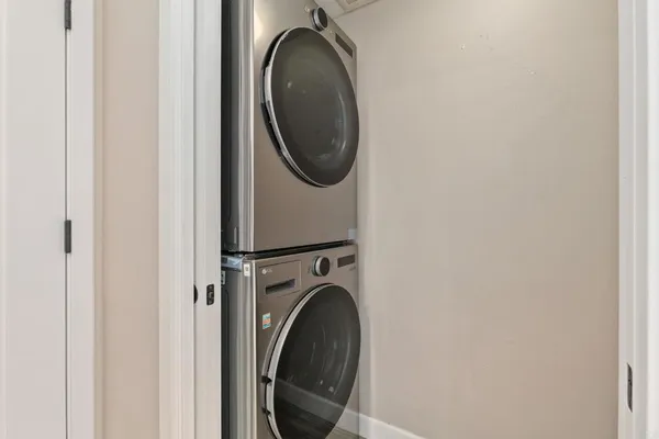 a bathroom with a sink vanity mirror and toilet