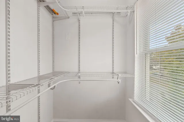 a bathroom with a shower and a sink