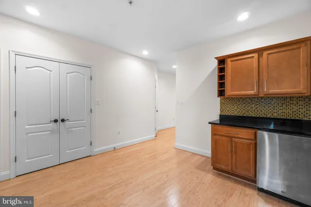 a kitchen with granite countertop cabinets and window