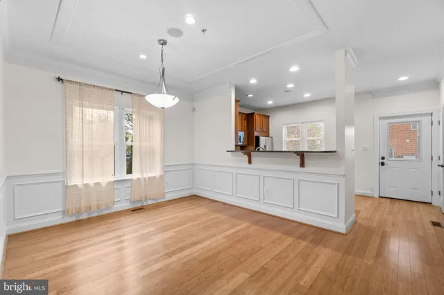 a view of a kitchen with microwave and cabinets