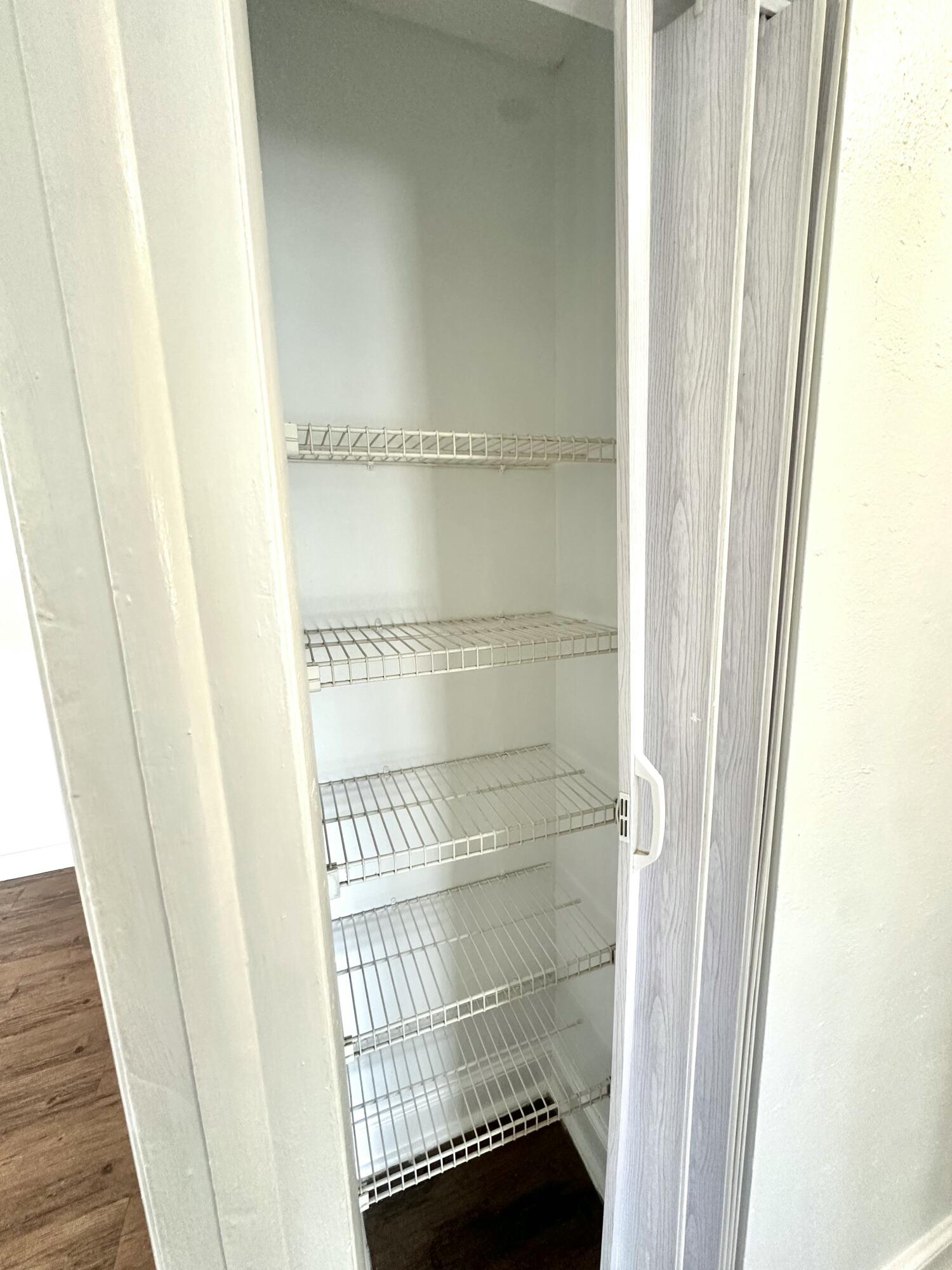 210 Tiffany Drive East, Unit 1 West Palm Beach, FL 33407 - Photo 3 of 10 a view of a closet