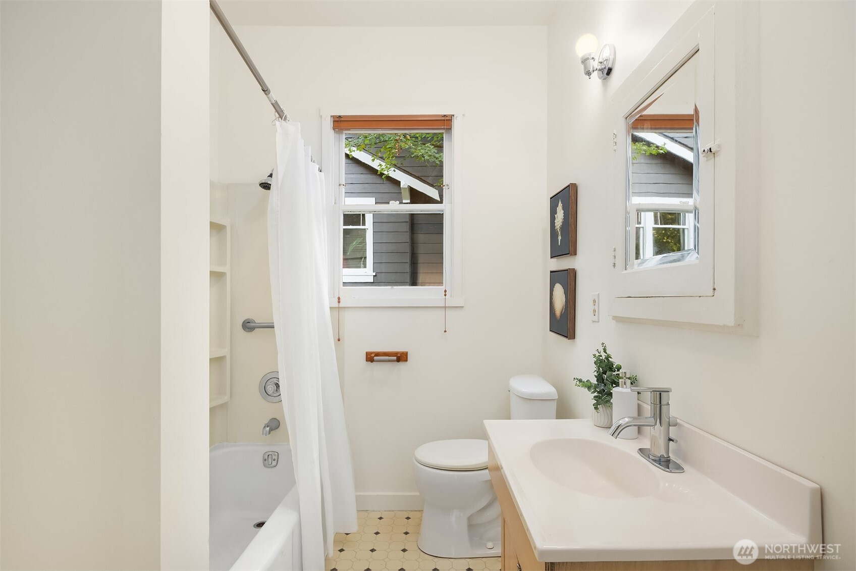 5722 Keystone Place North Seattle, WA 98103 - Photo 19 of 38 a bathroom with a sink toilet and shower