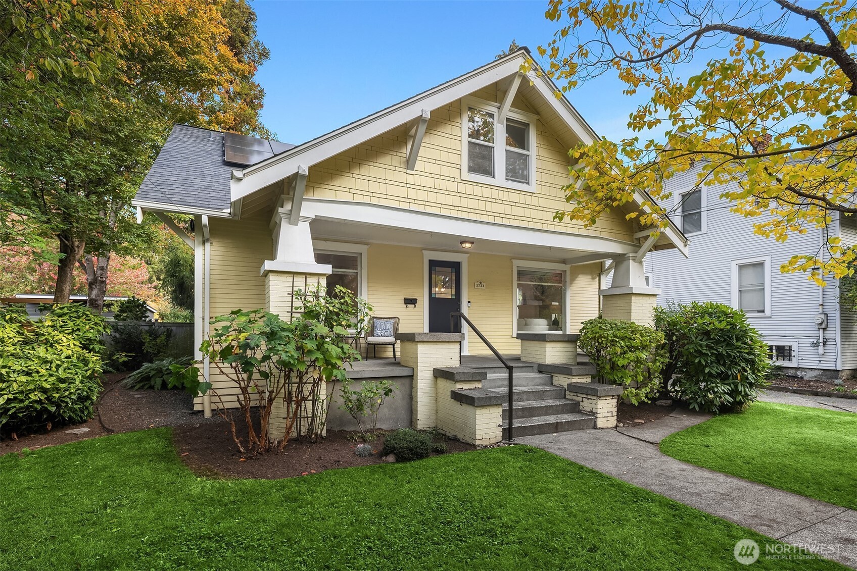 5722 Keystone Place North Seattle, WA 98103 - Photo 2 of 38 a front view of a house with a garden and plants