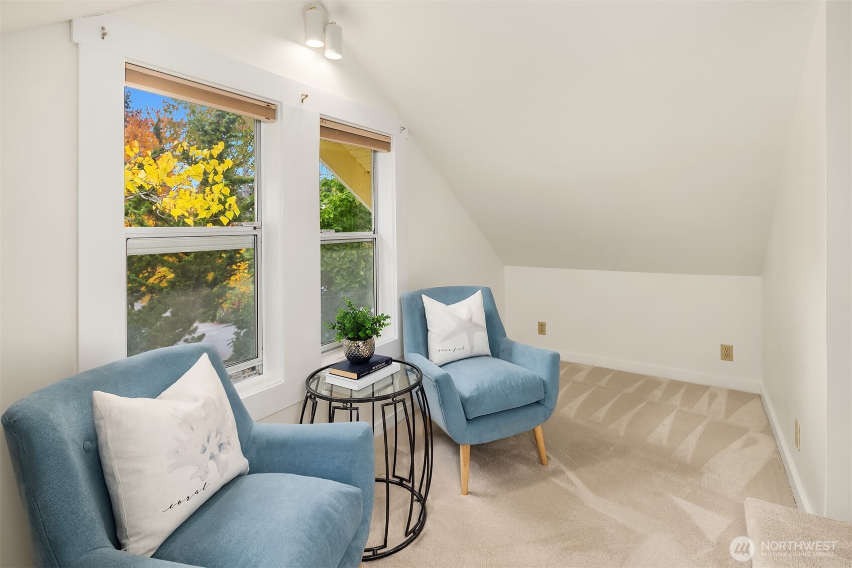 5722 Keystone Place North Seattle, WA 98103 - Photo 22 of 38 a living room with furniture and a large window