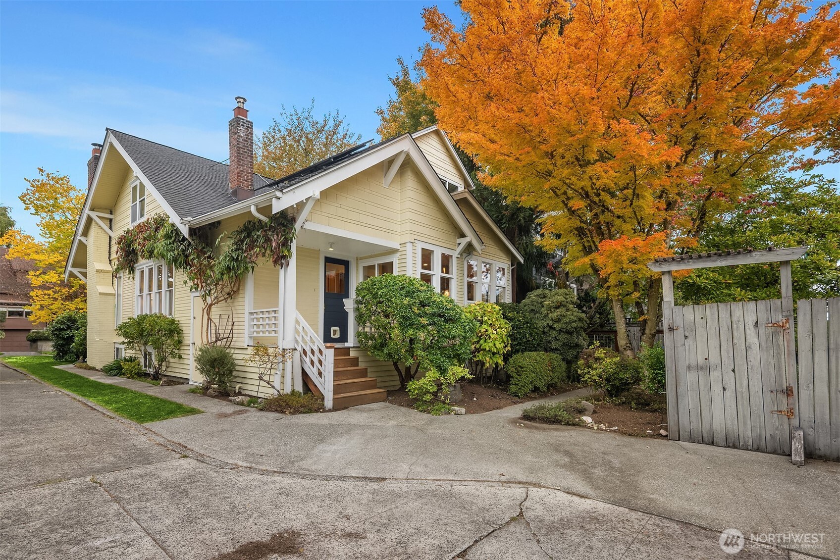 5722 Keystone Place North Seattle, WA 98103 - Photo 33 of 38 a view of a house with a small yard plants and large tree