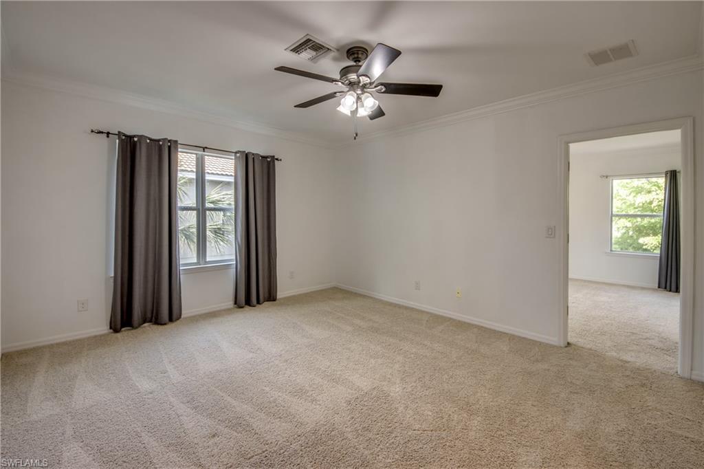 19530 Bowring Park Road, Unit 106 Fort Myers, FL 33967 - Photo 12 of 39 a view of a livingroom with a ceiling fan and window