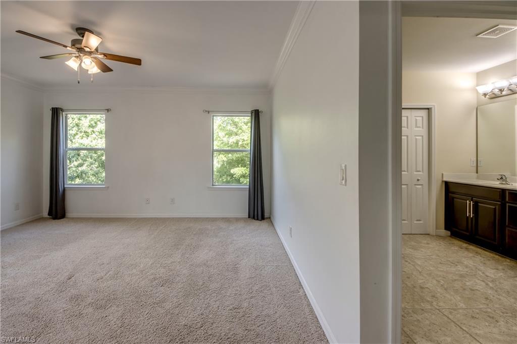 19530 Bowring Park Road, Unit 106 Fort Myers, FL 33967 - Photo 17 of 39 an empty room with windows and closet