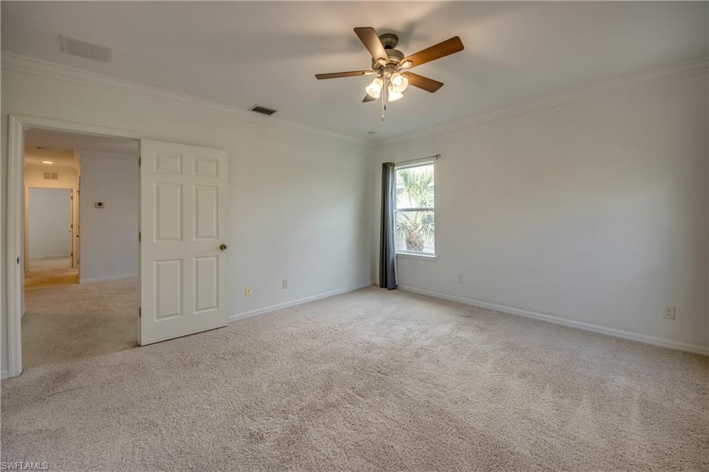 19530 Bowring Park Road, Unit 106 Fort Myers, FL 33967 - Photo 19 of 39 an empty room with windows and entrance