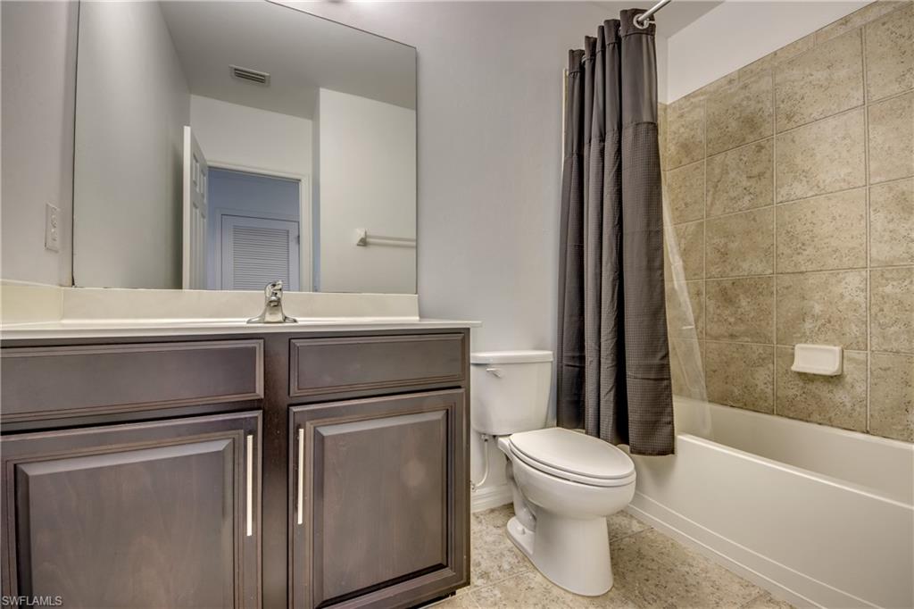 19530 Bowring Park Road, Unit 106 Fort Myers, FL 33967 - Photo 24 of 39 a bathroom with a toilet sink and a bathtub