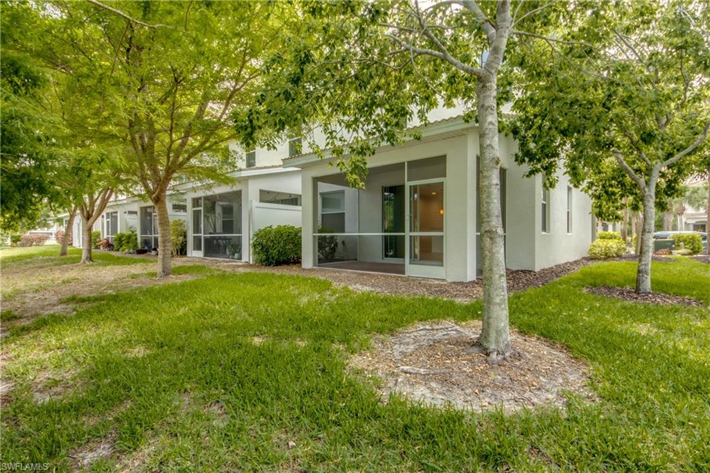 19530 Bowring Park Road, Unit 106 Fort Myers, FL 33967 - Photo 33 of 39 front view of a house with a yard