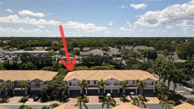 an aerial view of a house with a lake view