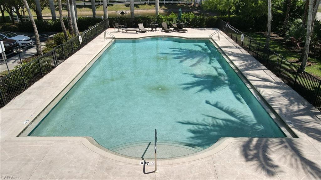 19530 Bowring Park Road, Unit 106 Fort Myers, FL 33967 - Photo 39 of 39 a view of a swimming pool with a yard