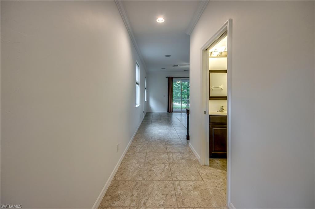 19530 Bowring Park Road, Unit 106 Fort Myers, FL 33967 - Photo 7 of 39 wooden floor with a window in a room
