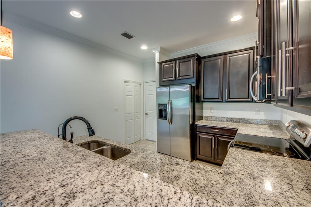 19530 Bowring Park Road, Unit 106 Fort Myers, FL 33967 - Photo 8 of 39 a bathroom with a sink and a mirror