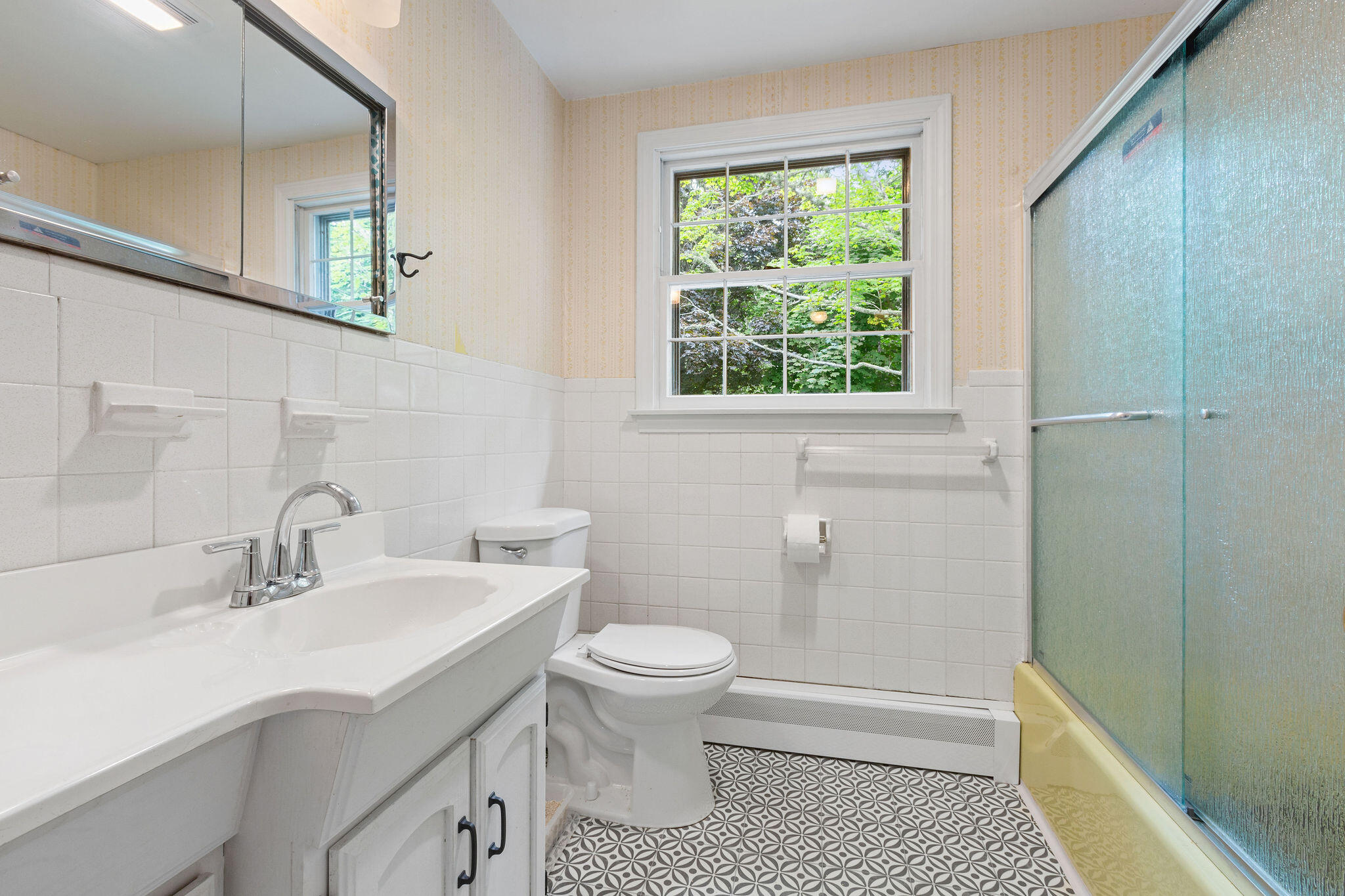 9 South Highland Road Truro, MA 02666 - Photo 19 of 32 a bathroom with a sink a toilet and a mirror