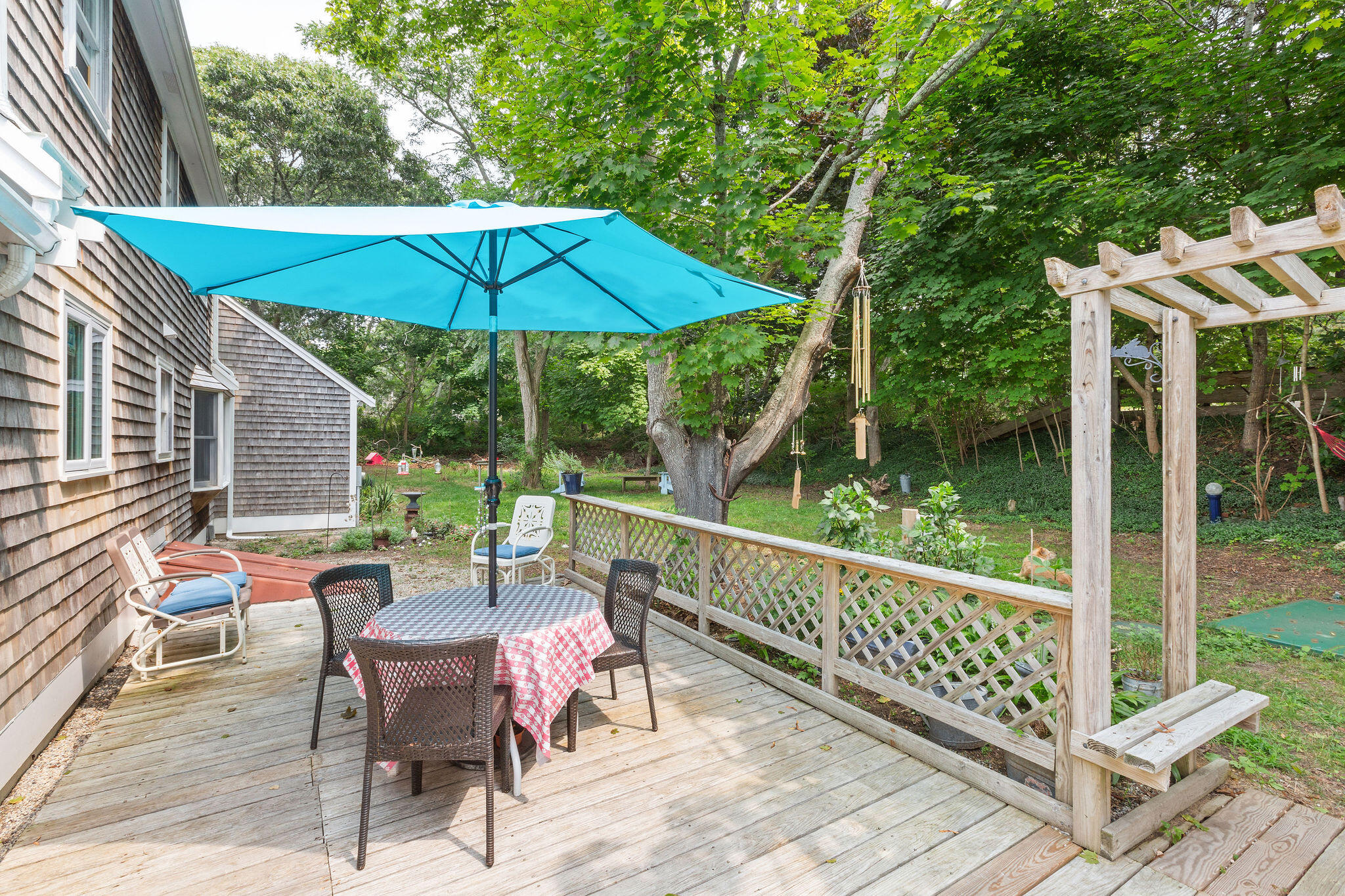 9 South Highland Road Truro, MA 02666 - Photo 21 of 32 a view of a chair and table in the balcony