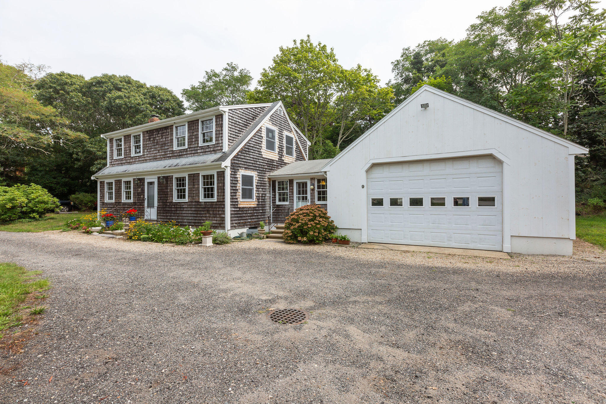 9 South Highland Road Truro, MA 02666 - Photo 26 of 32 a view of a house with a yard and potted plants
