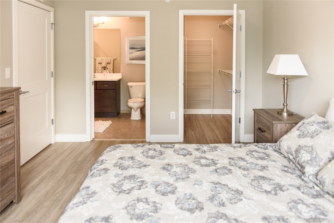 502 New Terrace Lane Ogden, NY 14624 - Photo 11 of 27 Typical primary bedroom with walk-in closet & ensu