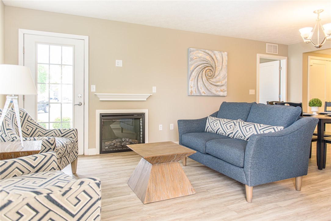 502 New Terrace Lane Ogden, NY 14624 - Photo 2 of 27 View of typical great room with fireplace and door