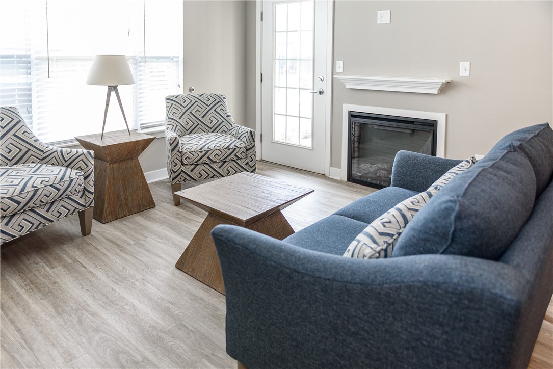 502 New Terrace Lane Ogden, NY 14624 - Photo 6 of 27 Typical great room with focus on the living area &