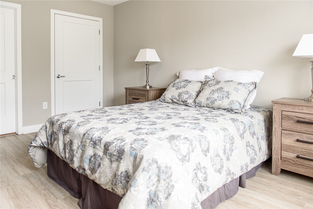 502 New Terrace Lane Ogden, NY 14624 - Photo 10 of 27 Typical primary bedroom with walk-in closet & ensu