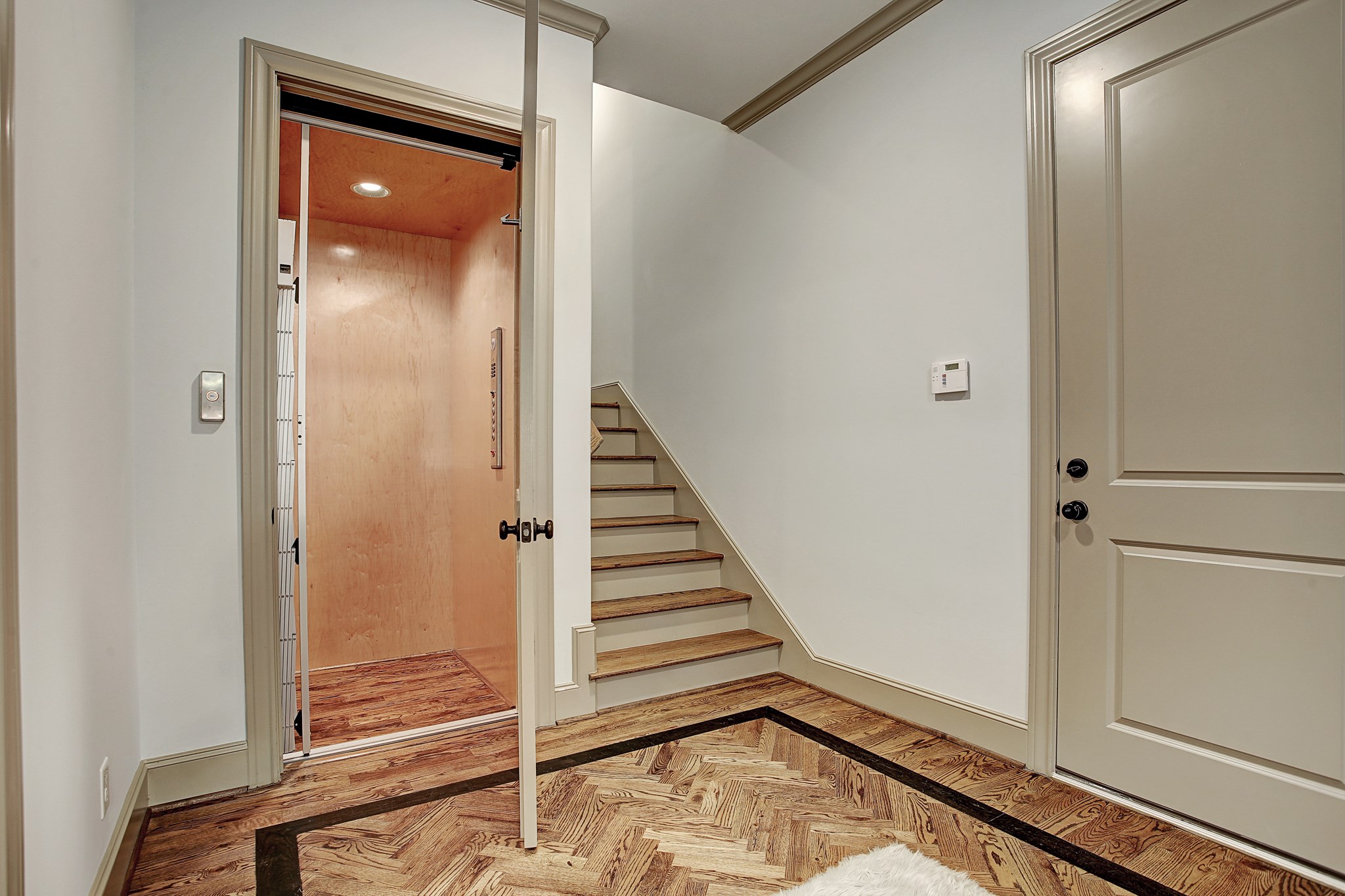 1307 Rosedale Street Houston, TX 77004 - Photo 7 of 32 a view of a hallway with wooden floor and entryway