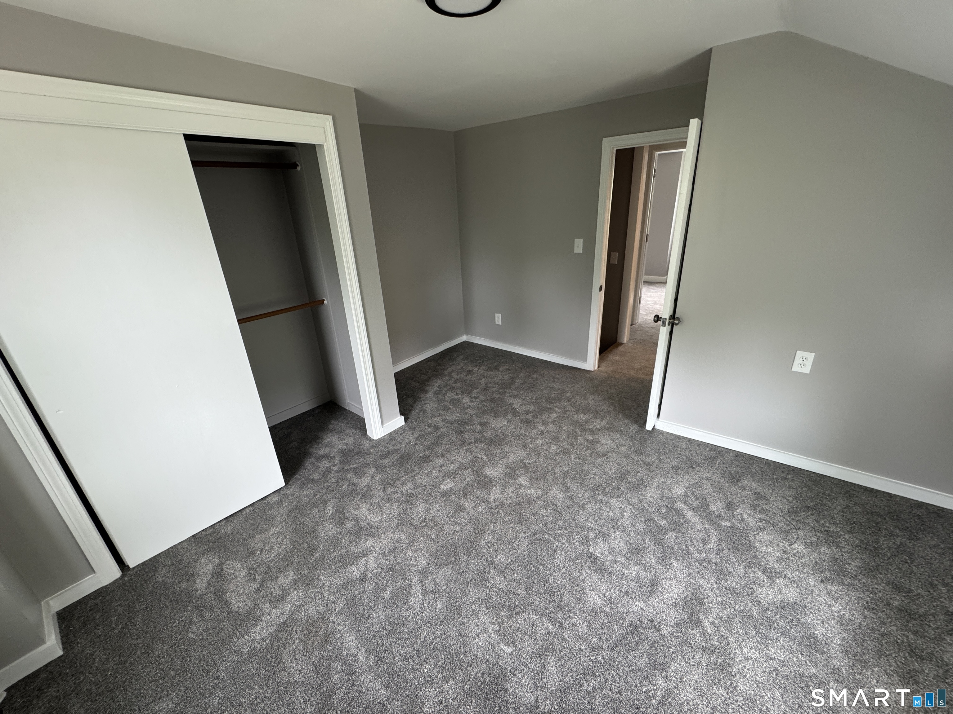 10 Center Street Windsor Locks, CT 06096 - Photo 9 of 25 an empty room with a door