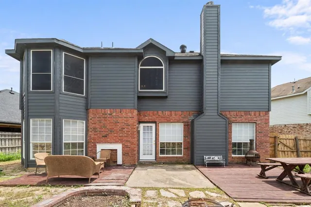 a front view of a house with parking space