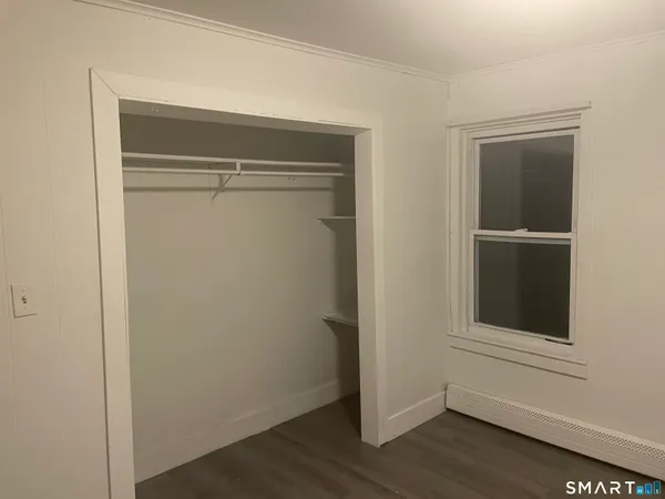 a view of an empty walk in closet