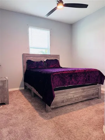a view of bedroom with furniture and window