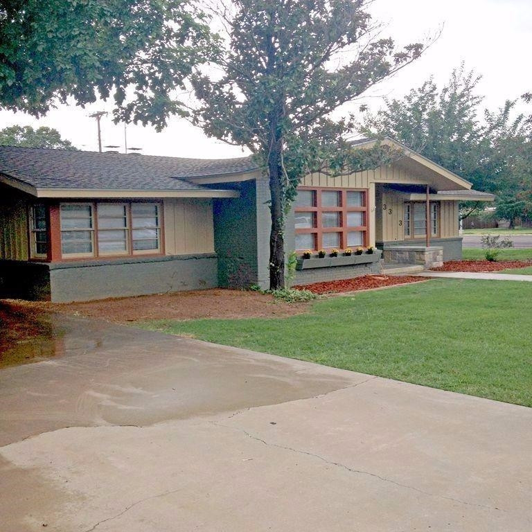 3313 45th Street Lubbock, TX 79413 - Photo 3 of 10 a front view of a house with a yard and garage