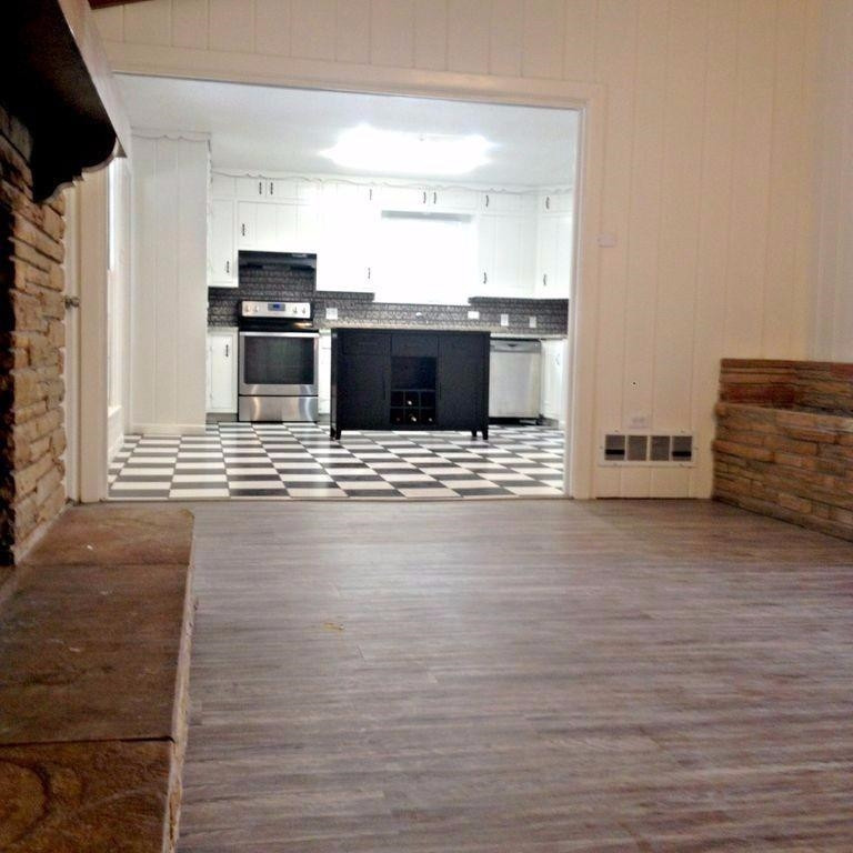 3313 45th Street Lubbock, TX 79413 - Photo 9 of 10 a view of kitchen with stainless steel appliances wooden floor and living room