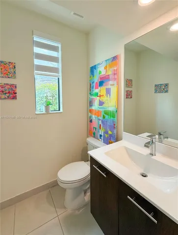 an empty room with closet and a window