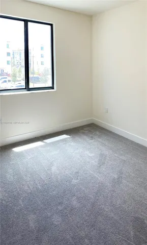 a living room with lots of furniture and a flat screen tv