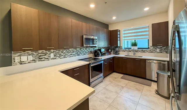 a bathroom with a sink double vanity and a mirror