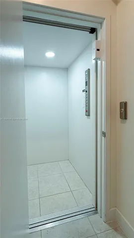 a kitchen with stainless steel appliances kitchen island granite countertop a sink and cabinets