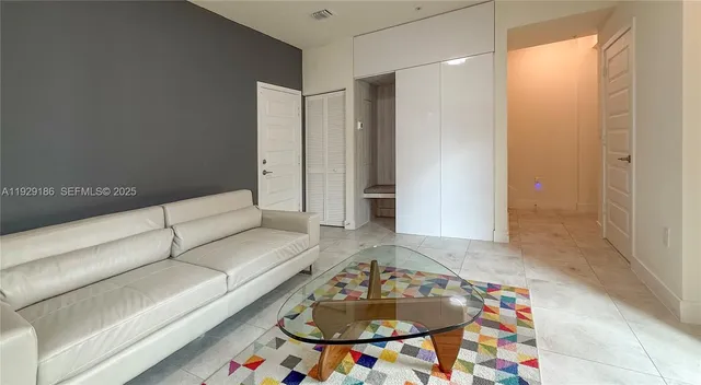 a view of a building with car parked