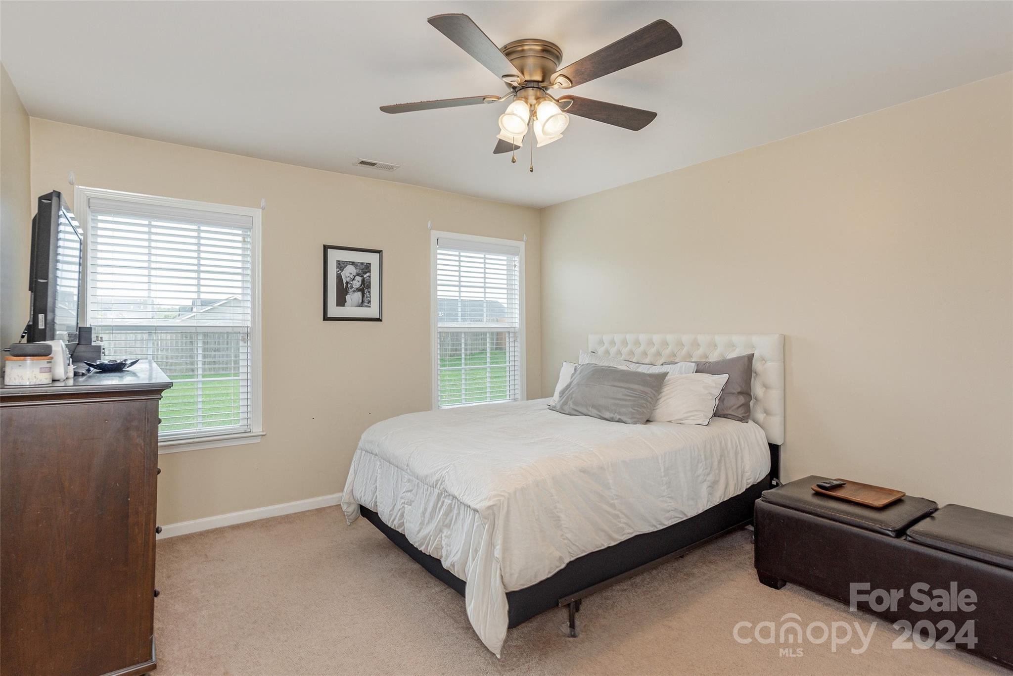 48 East Hiawassee Road Fletcher, NC 28732 - Photo 11 of 20 a bedroom with a bed dresser and a window