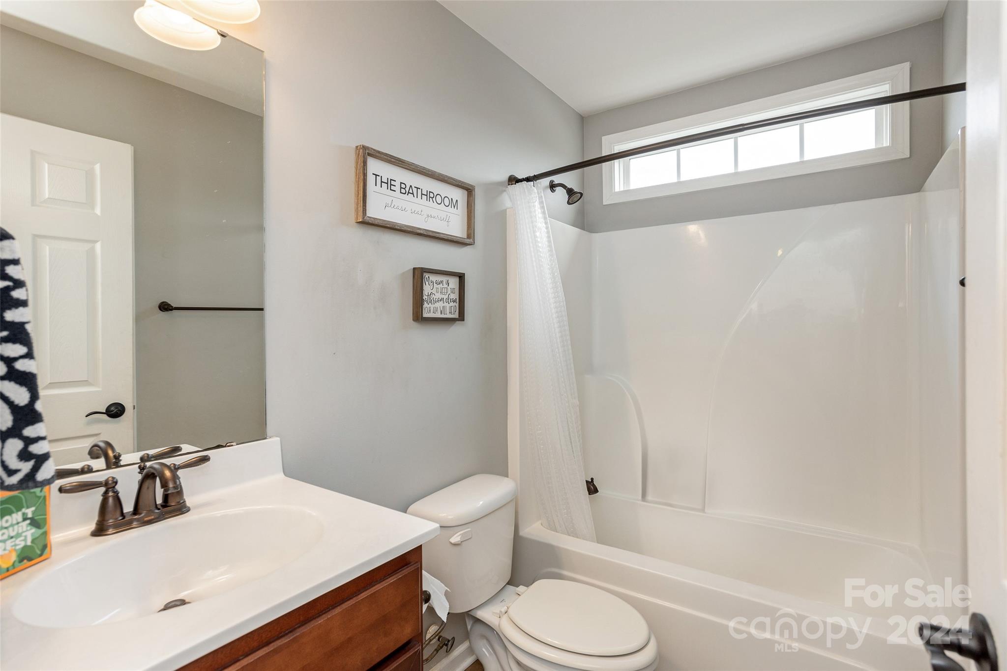 48 East Hiawassee Road Fletcher, NC 28732 - Photo 14 of 20 a bathroom with a sink toilet and shower