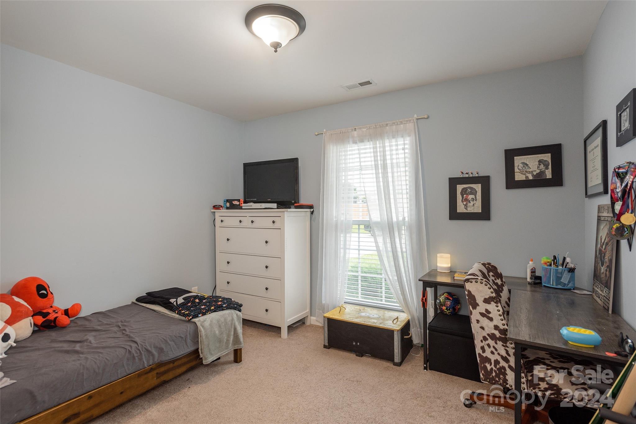 48 East Hiawassee Road Fletcher, NC 28732 - Photo 15 of 20 a bed room with a bed and a window