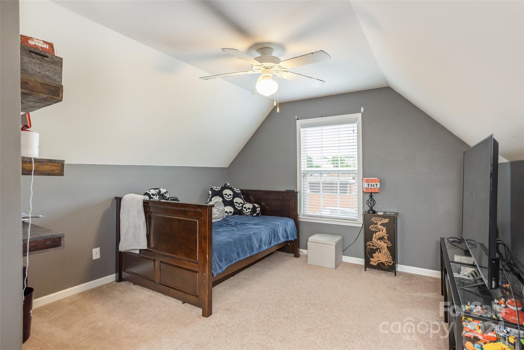 48 East Hiawassee Road Fletcher, NC 28732 - Photo 16 of 20 a bed room with a bed and a flat tv screen on a dresser