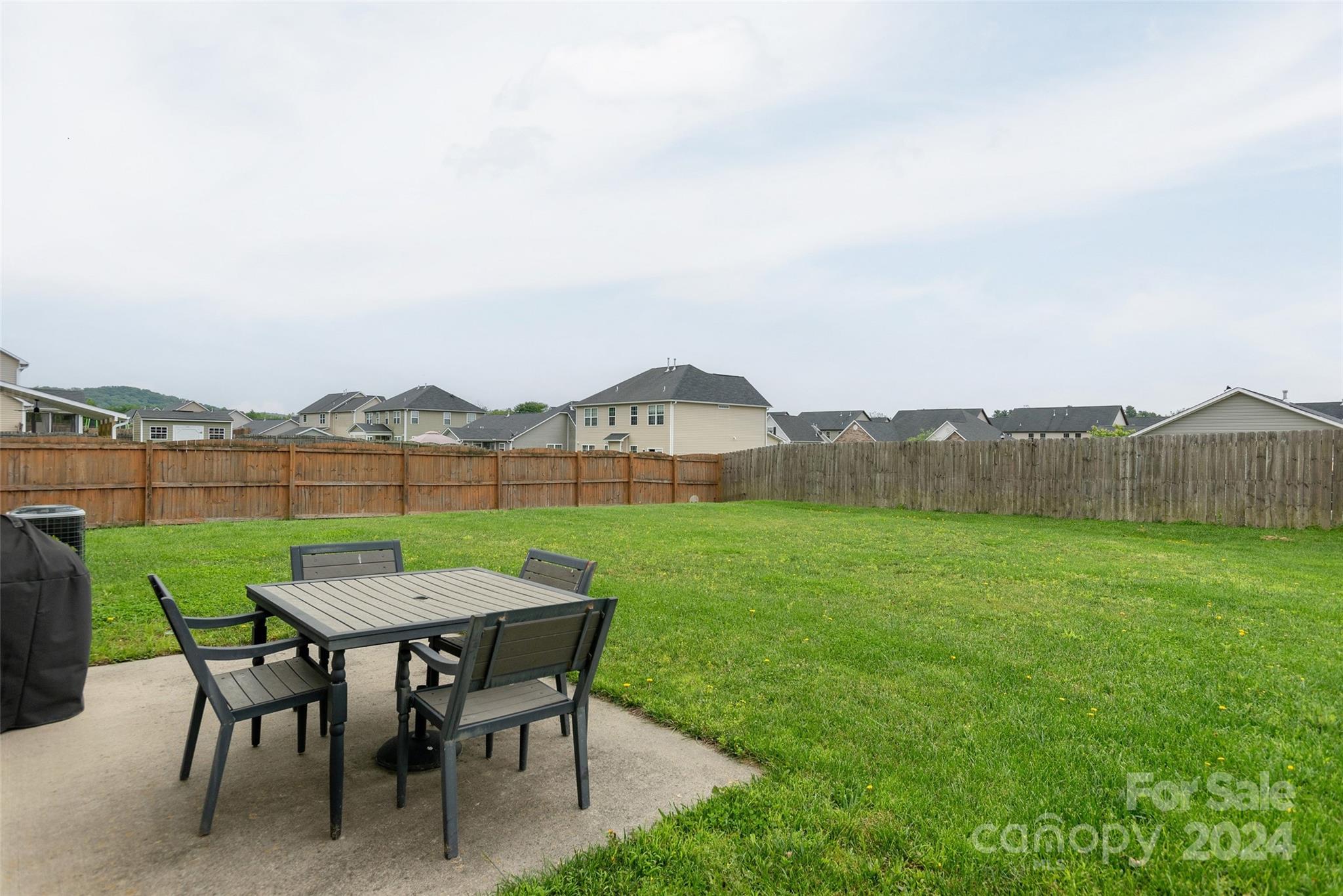 48 East Hiawassee Road Fletcher, NC 28732 - Photo 17 of 20 a view of a chairs and table in patio