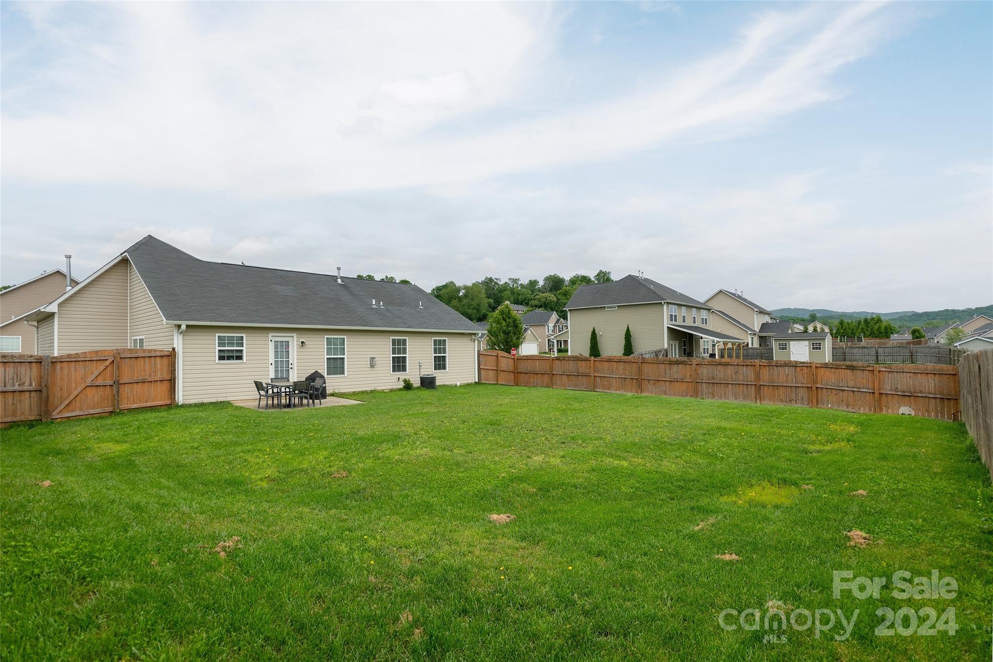 48 East Hiawassee Road Fletcher, NC 28732 - Photo 20 of 20 a house with a garden
