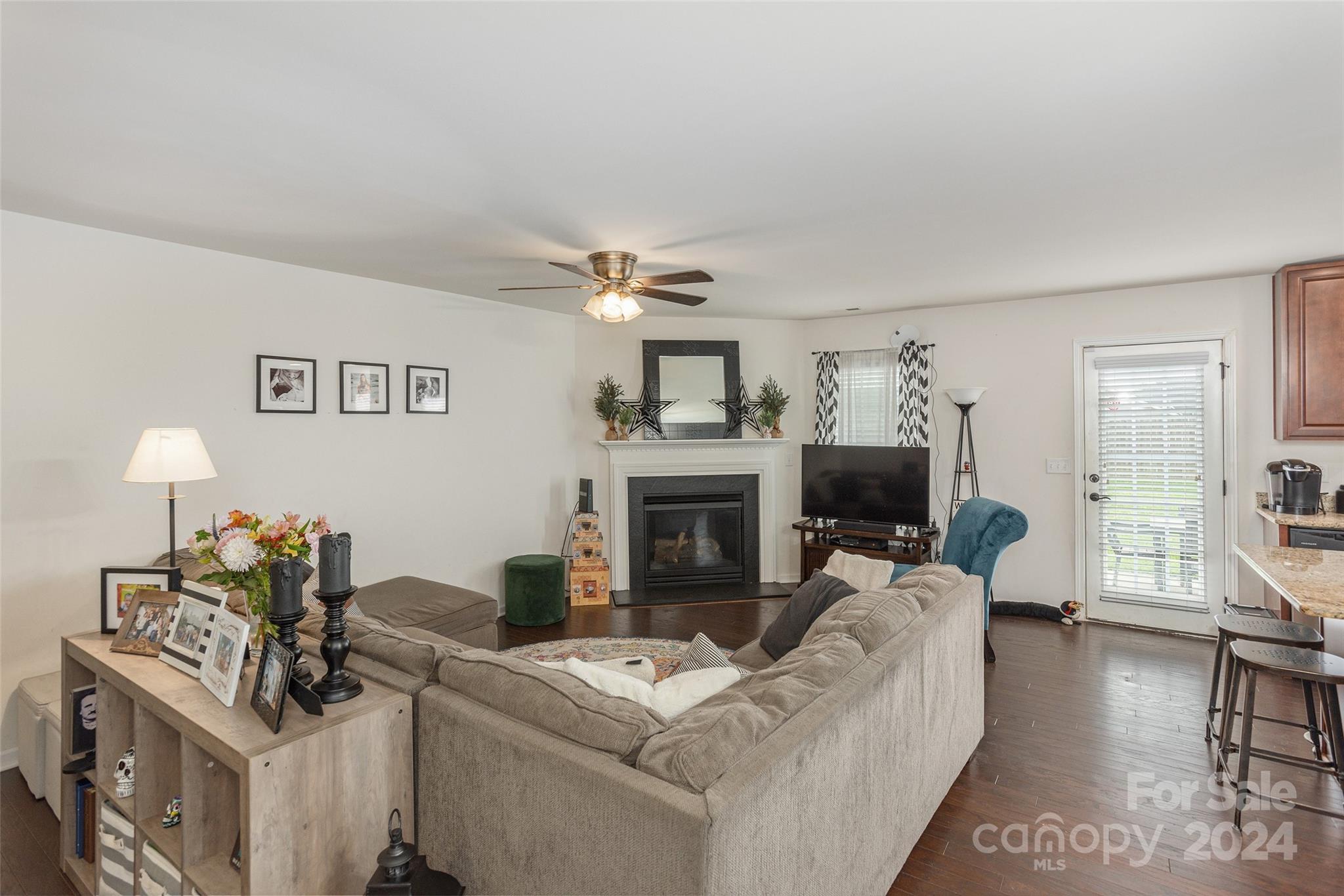 48 East Hiawassee Road Fletcher, NC 28732 - Photo 3 of 20 a living room with furniture and a fireplace