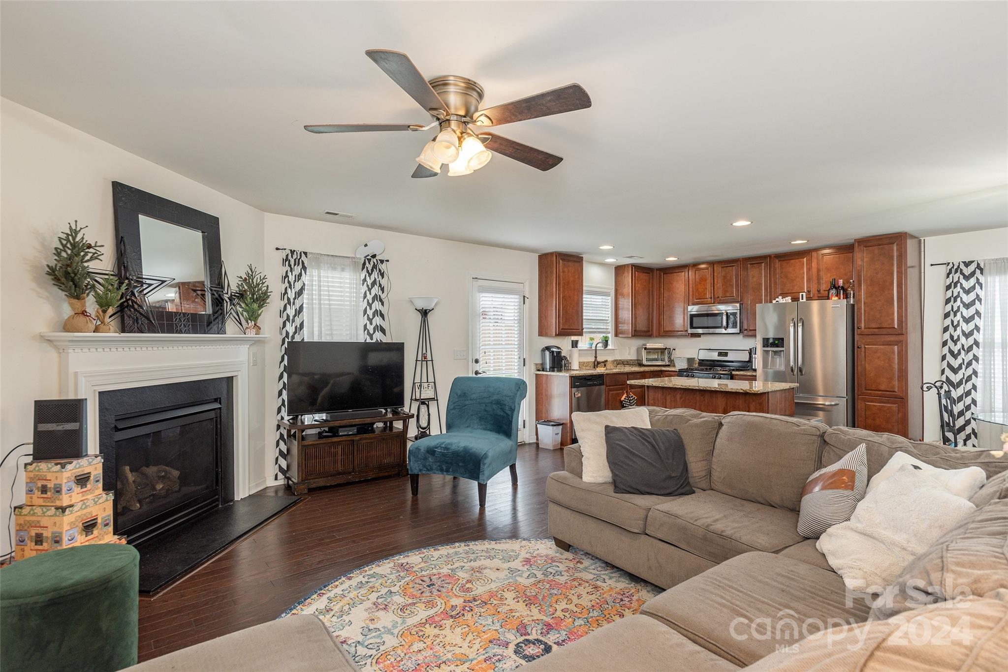 48 East Hiawassee Road Fletcher, NC 28732 - Photo 5 of 20 a living room with furniture a fireplace and a flat screen tv